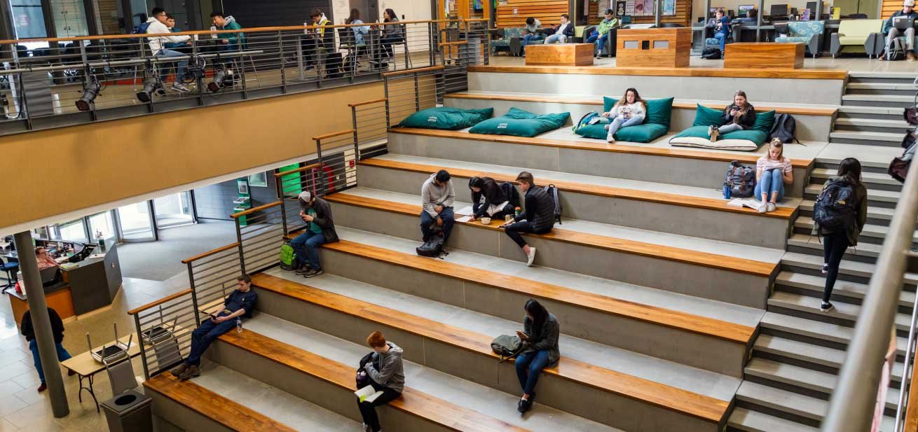 Students studying in large common area