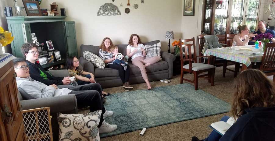 people sitting on couches in a home